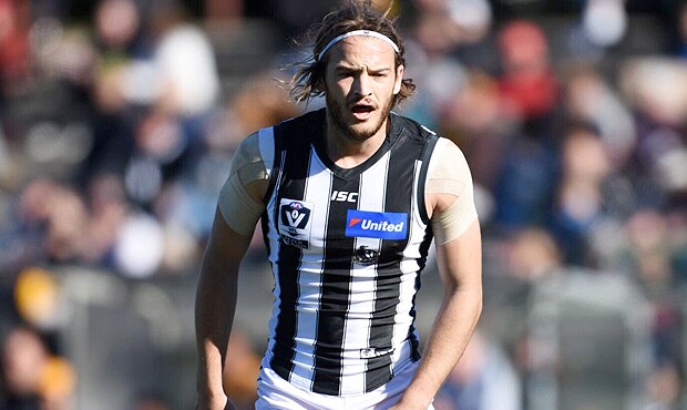 180805_aish620a.png James Aish watches on during the first half. Photo: Luke Henry. - Collingwood Magpies,Collingwood